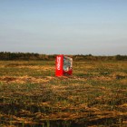 A vending machine, brought inland by a tsunami, is seen in a abandoned rice field inside the exclusion zone at the coastal area near Minamisoma in Fukushima prefecture